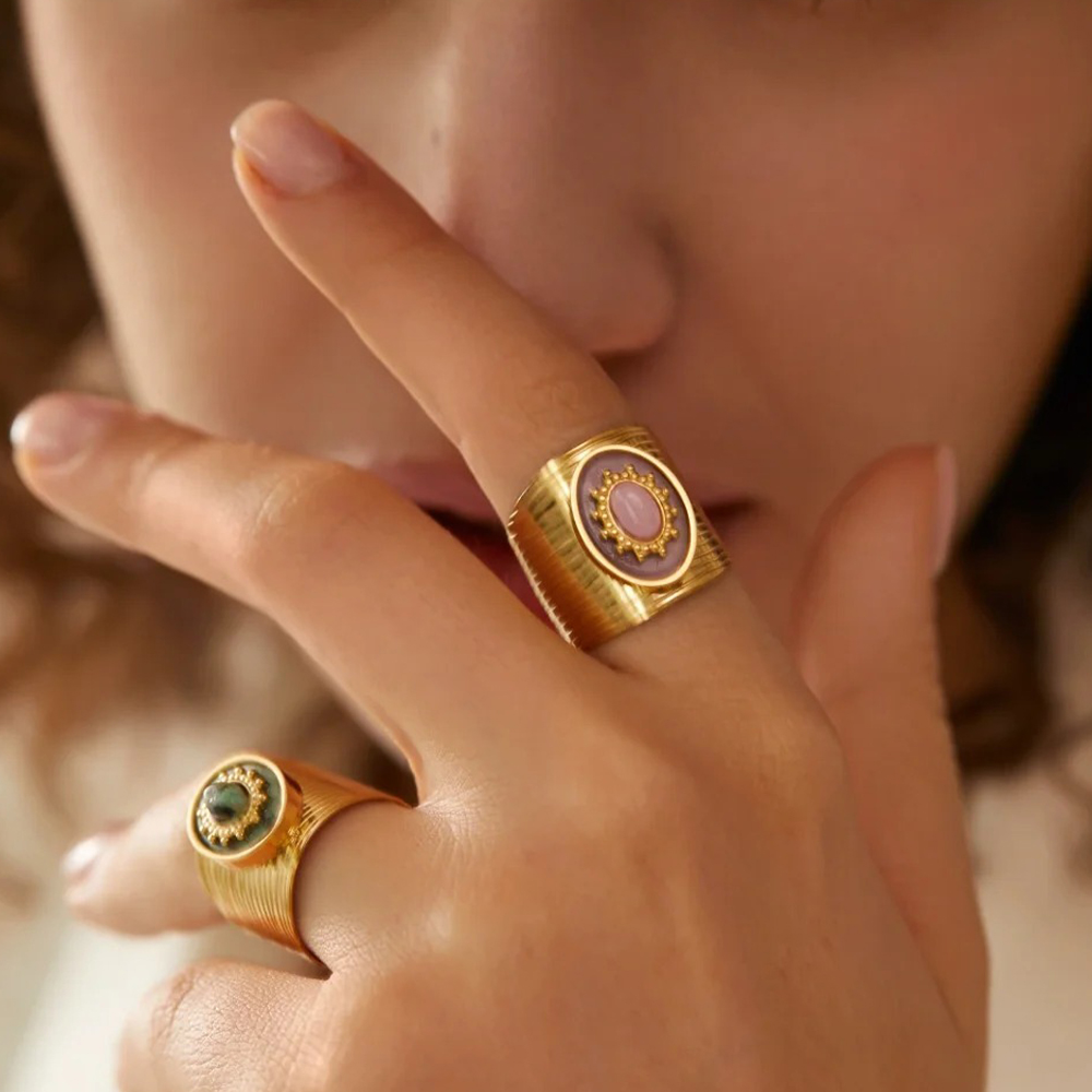 Women wear two gold rings on the index and ring fingers